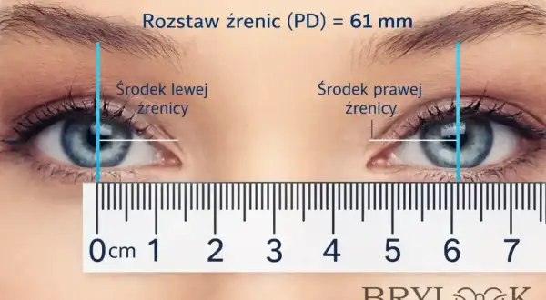Pomiar rozstawu źrenic (PD) na 61 mm. Linia pionowa wskazuje środek lewej i prawej źrenicy, a linijka pokazuje odległość.