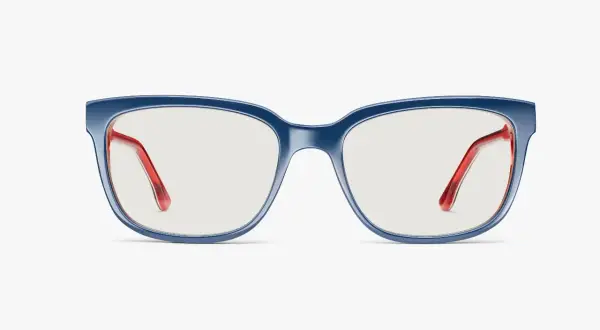 Eleganckie okulary korekcyjne w granatowej oprawce z czerwonymi zausznikami. Niebieskie szkła w okularach korekcyjnych zapewniają komfort widzenia.